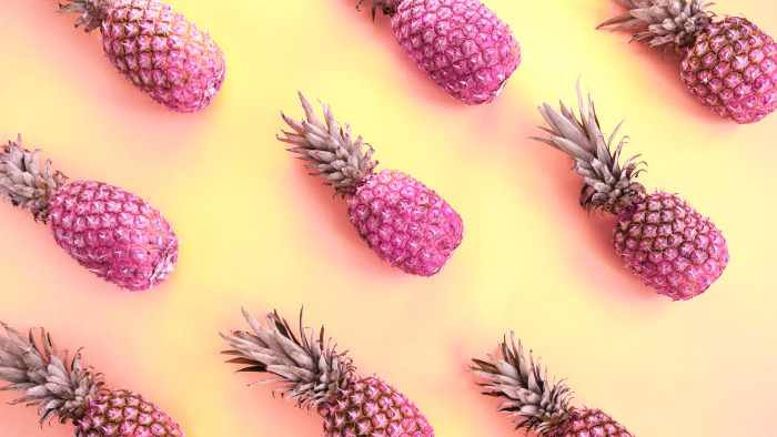 Pink pineapples background